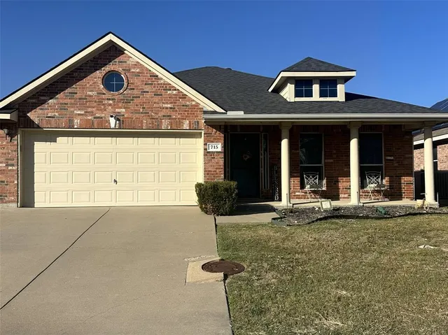a front view of a house with yard