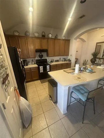 a kitchen with a sink a counter top space and appliances