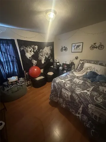 a bed room with a bed and a chair