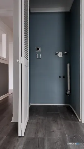 a view of room with window and a fireplace