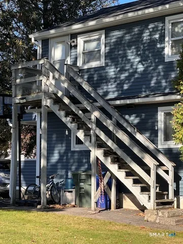 a view of room with window and wooden floor