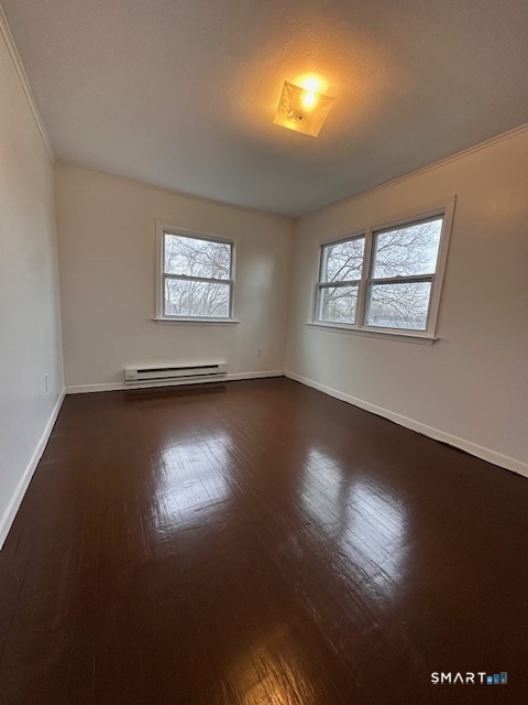 131 Ruth Street Bridgeport, CT 06606 - Photo 16 of 31 a view of room with window and wooden floor