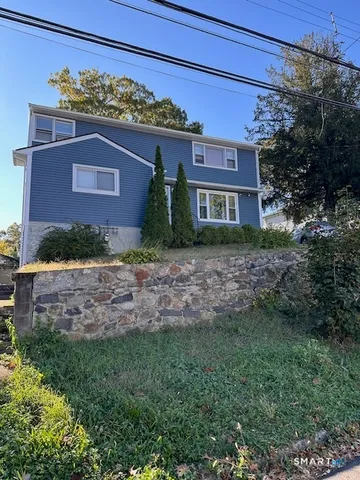 a view of a car in front of a house