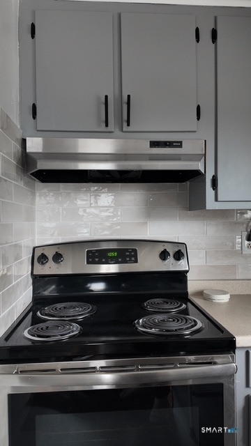 131 Ruth Street Bridgeport, CT 06606 - Photo 22 of 31 a close view of stove top oven