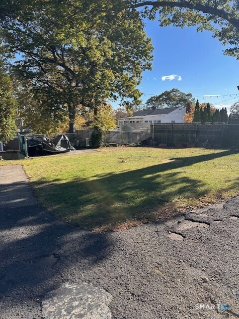 131 Ruth Street Bridgeport, CT 06606 - Photo 29 of 31 a view of a swimming pool with an outdoor space and seating area