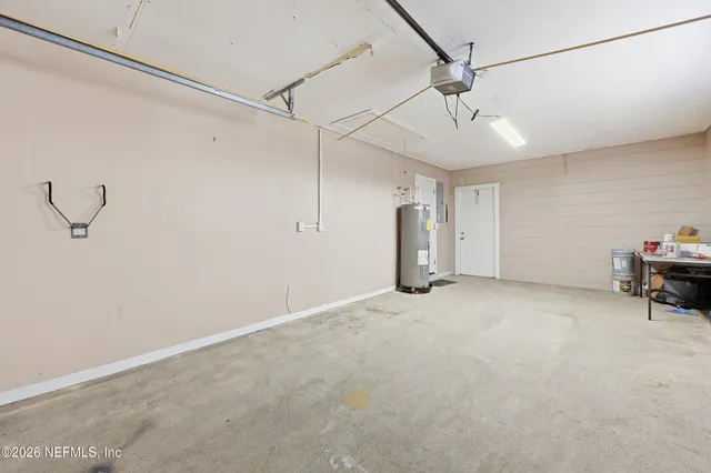 a view of a room with cabinet and a ceiling fan