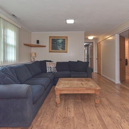 9 Jeffrey Road Canton, MA 02021 - Photo 23 of 38 a living room with furniture and a wooden floor