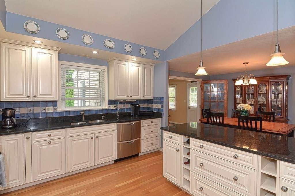 9 Jeffrey Road Canton, MA 02021 - Photo 3 of 38 a large kitchen with granite countertop a large window and white cabinets