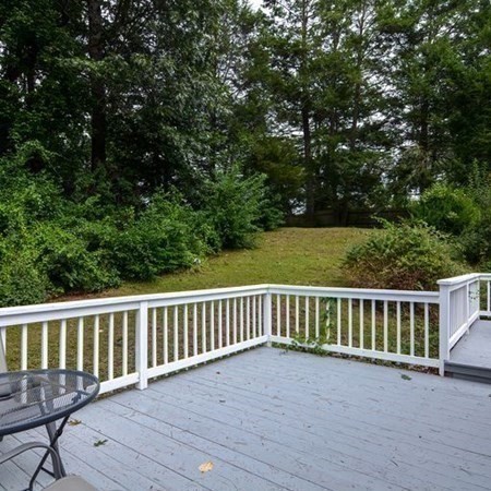 9 Jeffrey Road Canton, MA 02021 - Photo 34 of 38 a view of a wooden deck and a yard with seating space