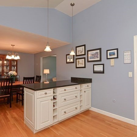 9 Jeffrey Road Canton, MA 02021 - Photo 4 of 38 a kitchen with granite countertop a cabinets and chandelier