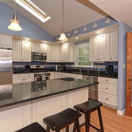 9 Jeffrey Road Canton, MA 02021 - Photo 5 of 38 a kitchen with stainless steel appliances kitchen island granite countertop a stove a sink and a refrigerator
