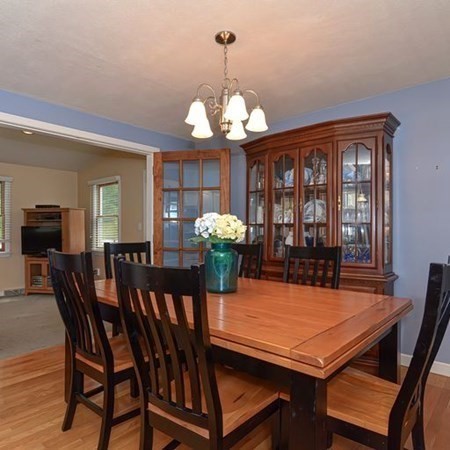 9 Jeffrey Road Canton, MA 02021 - Photo 7 of 38 a view of a dining room with furniture and chandelier