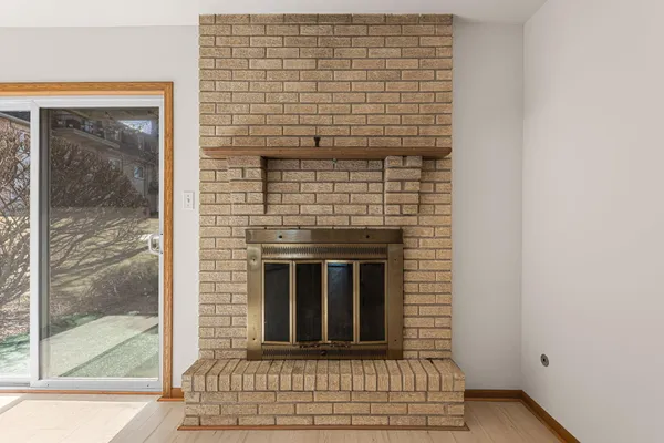 a view of fireplace and window
