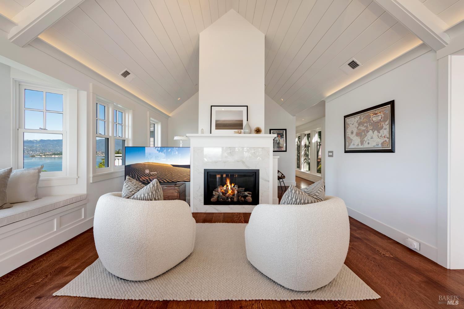 22 Eucalyptus Road Belvedere, CA 94920 - Photo 11 of 64 a living room with furniture and a fireplace
