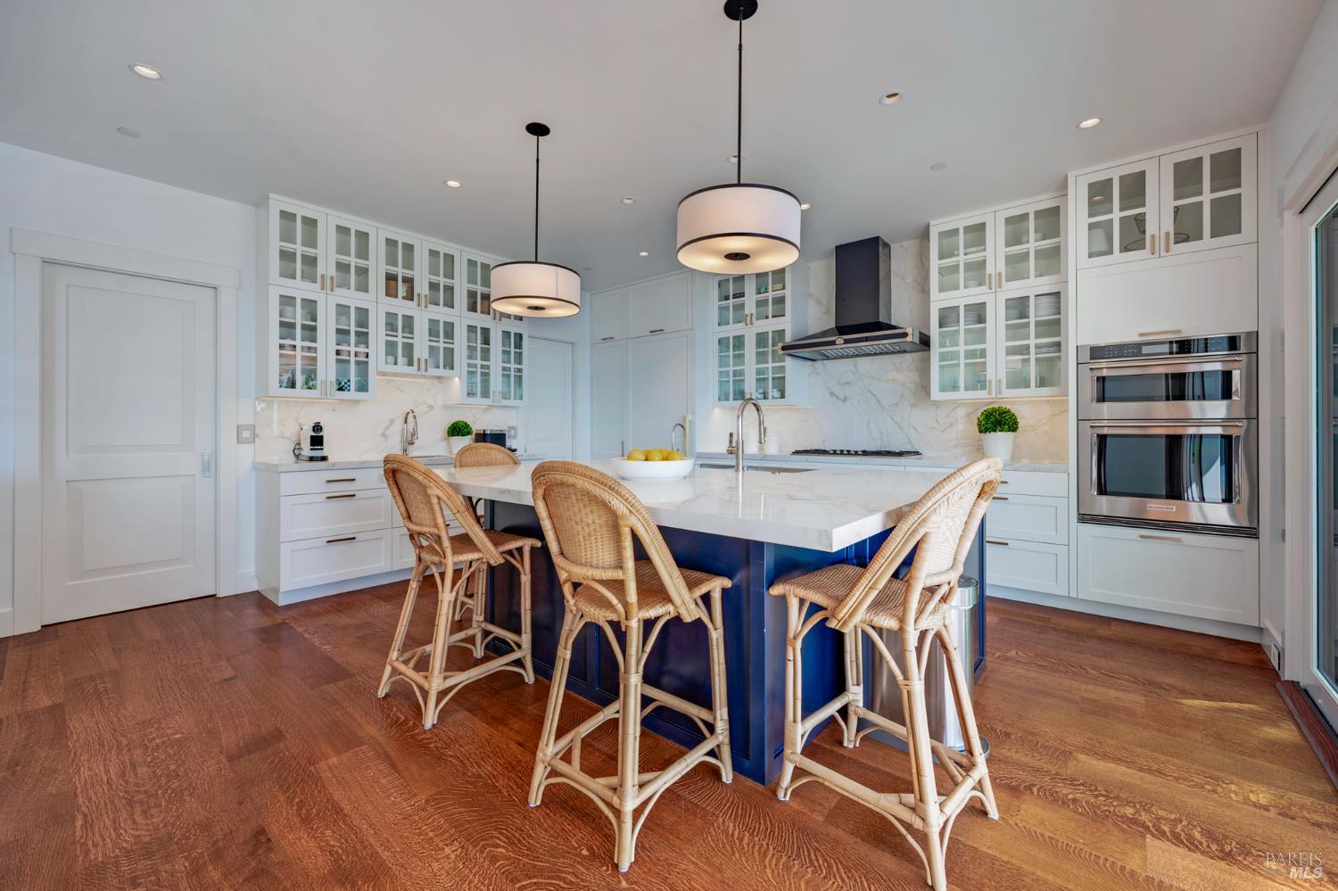 22 Eucalyptus Road Belvedere, CA 94920 - Photo 20 of 64 a view of a dining room with furniture window and wooden floor