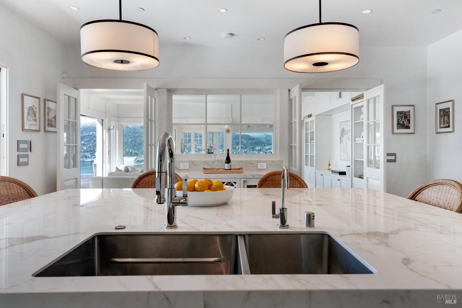 22 Eucalyptus Road Belvedere, CA 94920 - Photo 23 of 64 a kitchen with a sink a counter and a view of living room
