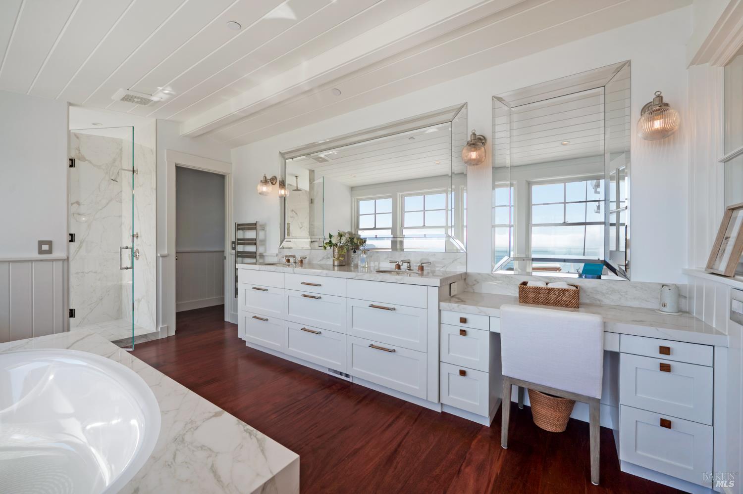 22 Eucalyptus Road Belvedere, CA 94920 - Photo 33 of 64 a spacious bathroom with a double vanity sink a mirror a bathtub and shower