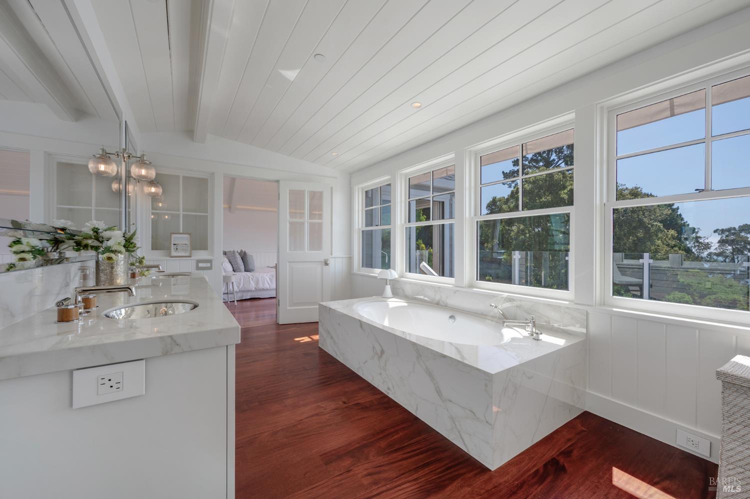 22 Eucalyptus Road Belvedere, CA 94920 - Photo 34 of 64 a bathroom with a sink double vanity and a large mirror
