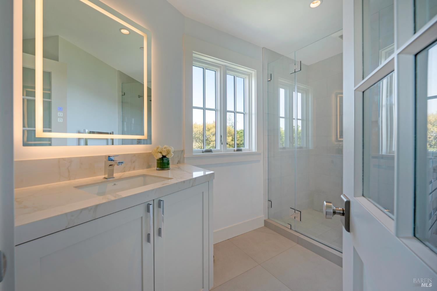22 Eucalyptus Road Belvedere, CA 94920 - Photo 43 of 64 a bathroom with a sink and a mirror