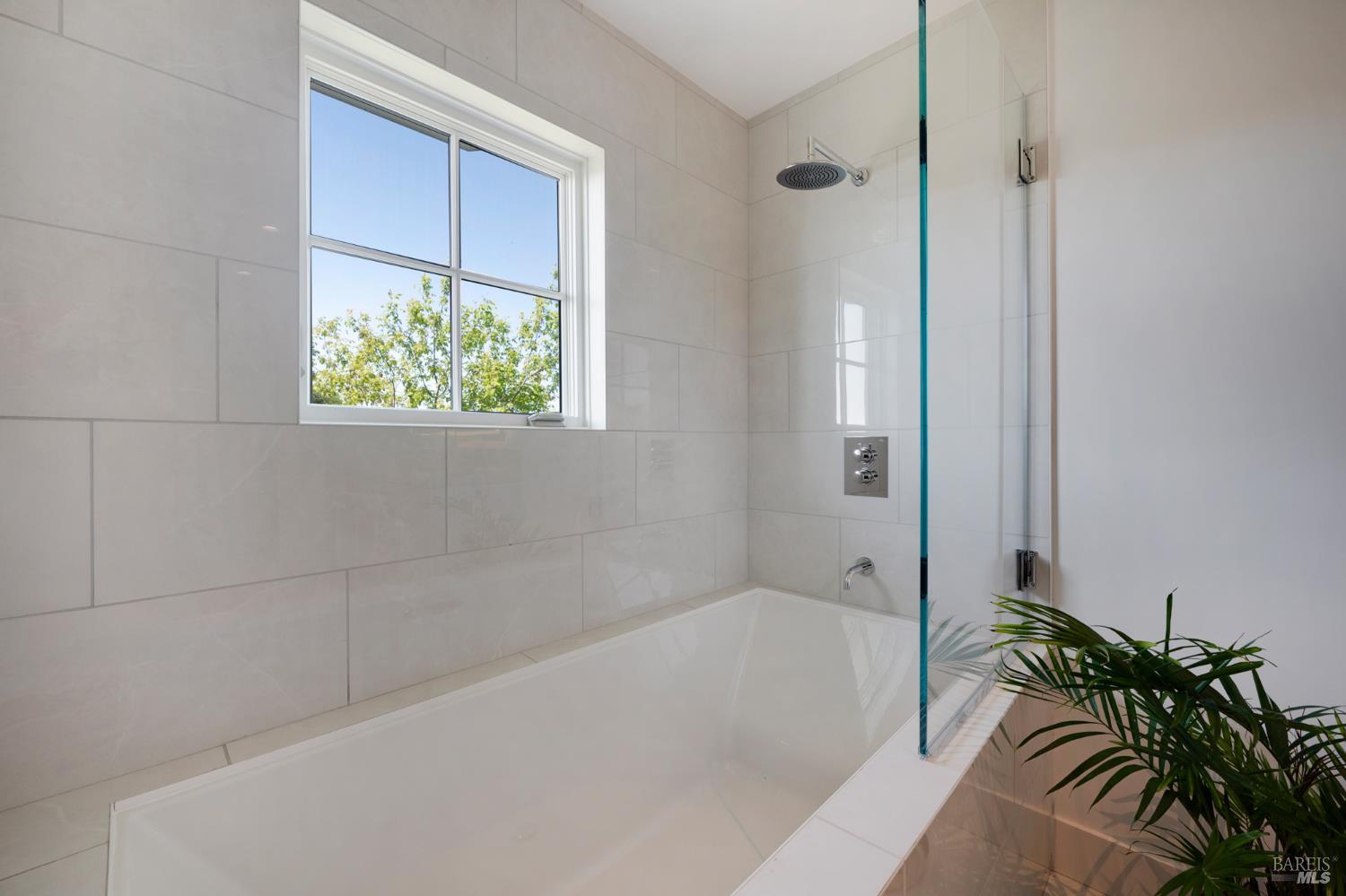 22 Eucalyptus Road Belvedere, CA 94920 - Photo 50 of 64 a bath tub sitting next to a shower