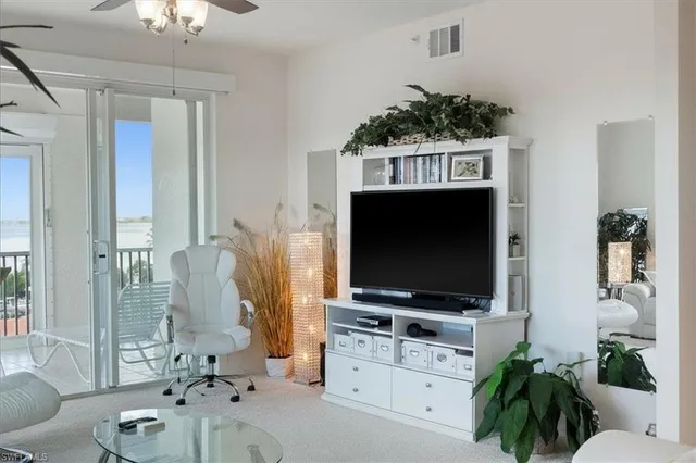 a dining room with furniture and a view of kitchen