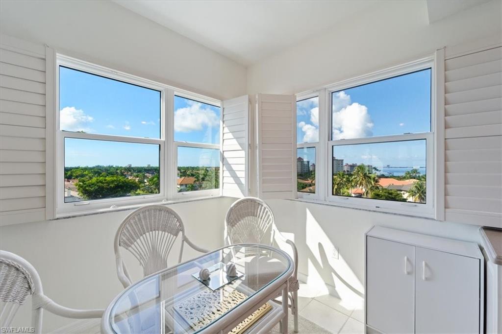 14819 Laguna Drive, Unit 501 Fort Myers, FL 33908 - Photo 21 of 48 a living room with furniture and a large window