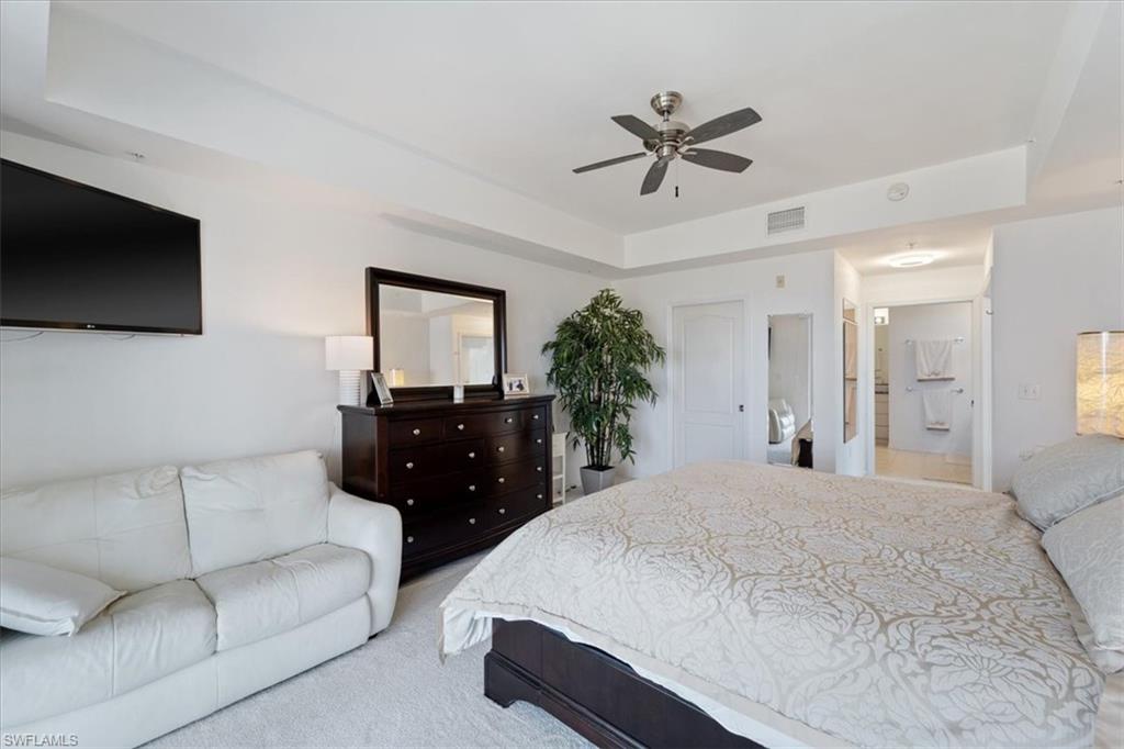 14819 Laguna Drive, Unit 501 Fort Myers, FL 33908 - Photo 27 of 48 a living room with furniture and a flat screen tv