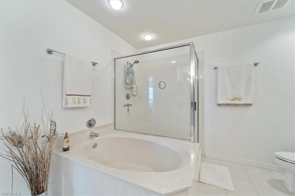 14819 Laguna Drive, Unit 501 Fort Myers, FL 33908 - Photo 30 of 48 a bathroom with a bathtub and a shower