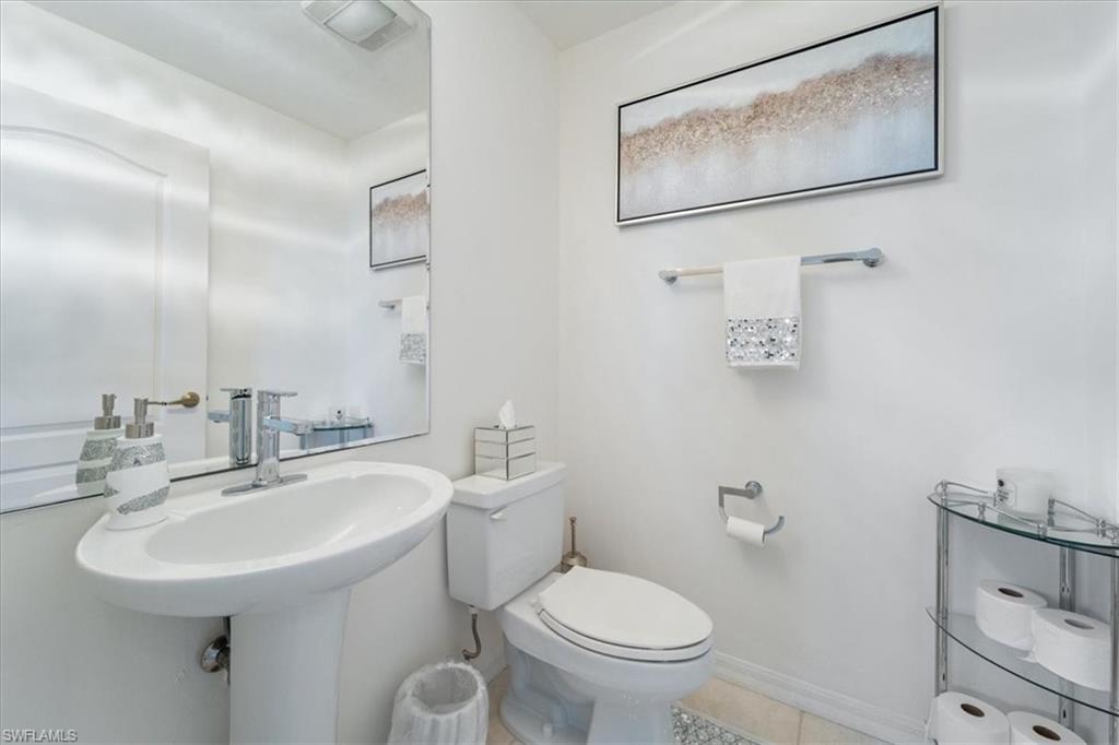 14819 Laguna Drive, Unit 501 Fort Myers, FL 33908 - Photo 32 of 48 a bathroom with a toilet sink and mirror