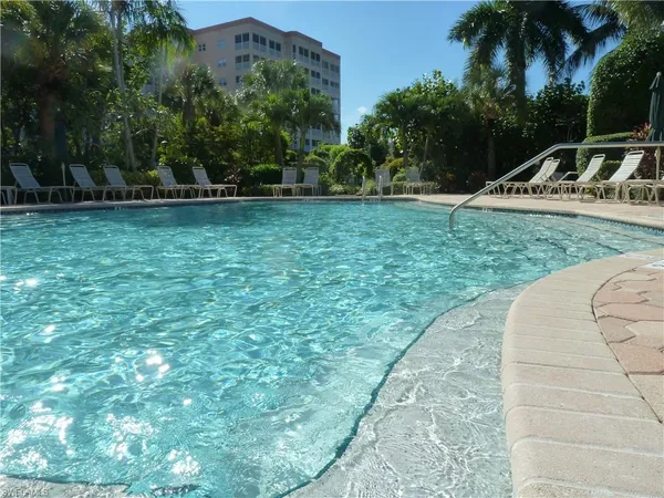 a view of swimming pool from a balcony
