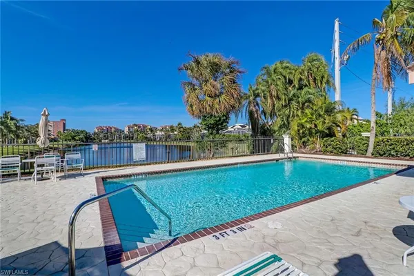 swimming pool view with a garden space
