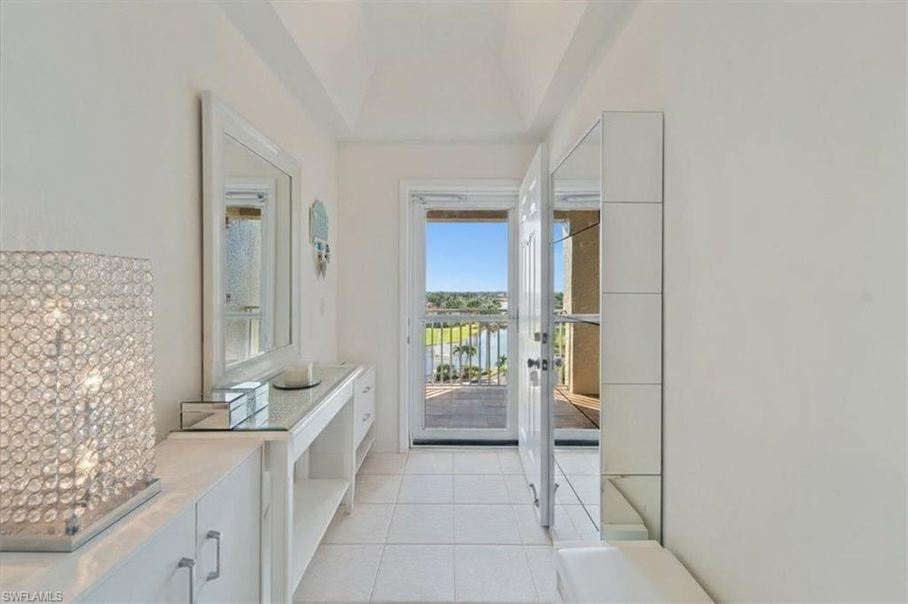 14819 Laguna Drive, Unit 501 Fort Myers, FL 33908 - Photo 7 of 48 a spacious bathroom with a bathtub and shower