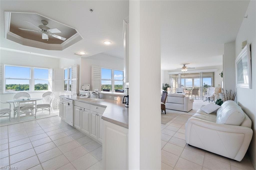 14819 Laguna Drive, Unit 501 Fort Myers, FL 33908 - Photo 9 of 48 a living room with furniture and a large window