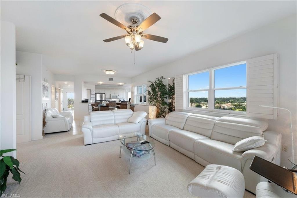 14819 Laguna Drive, Unit 501 Fort Myers, FL 33908 - Photo 10 of 48 a living room with furniture and a large window