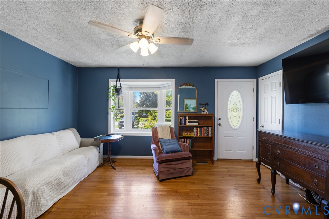 2980 Three Chopt Road Gum Spring, VA 23065 - Photo 6 of 27 a living room with furniture and a flat screen tv