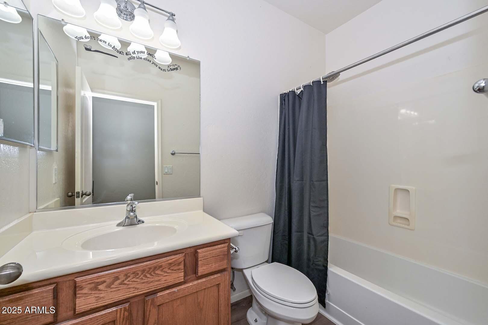 17687 West Charter Oak Road Surprise, AZ 85388 - Photo 23 of 52 a bathroom with a sink a toilet and shower
