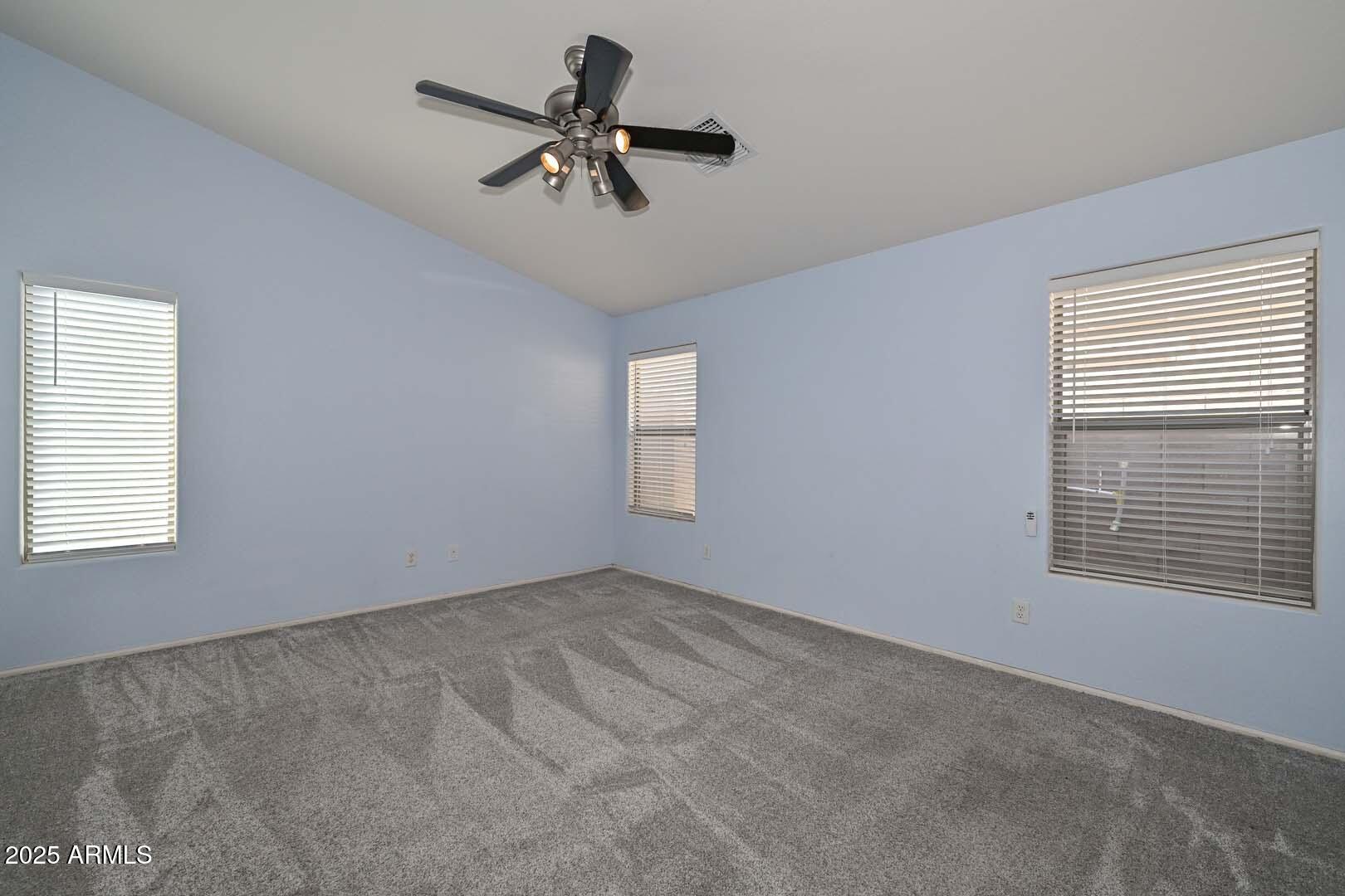 17687 West Charter Oak Road Surprise, AZ 85388 - Photo 25 of 52 a view of empty room with windows