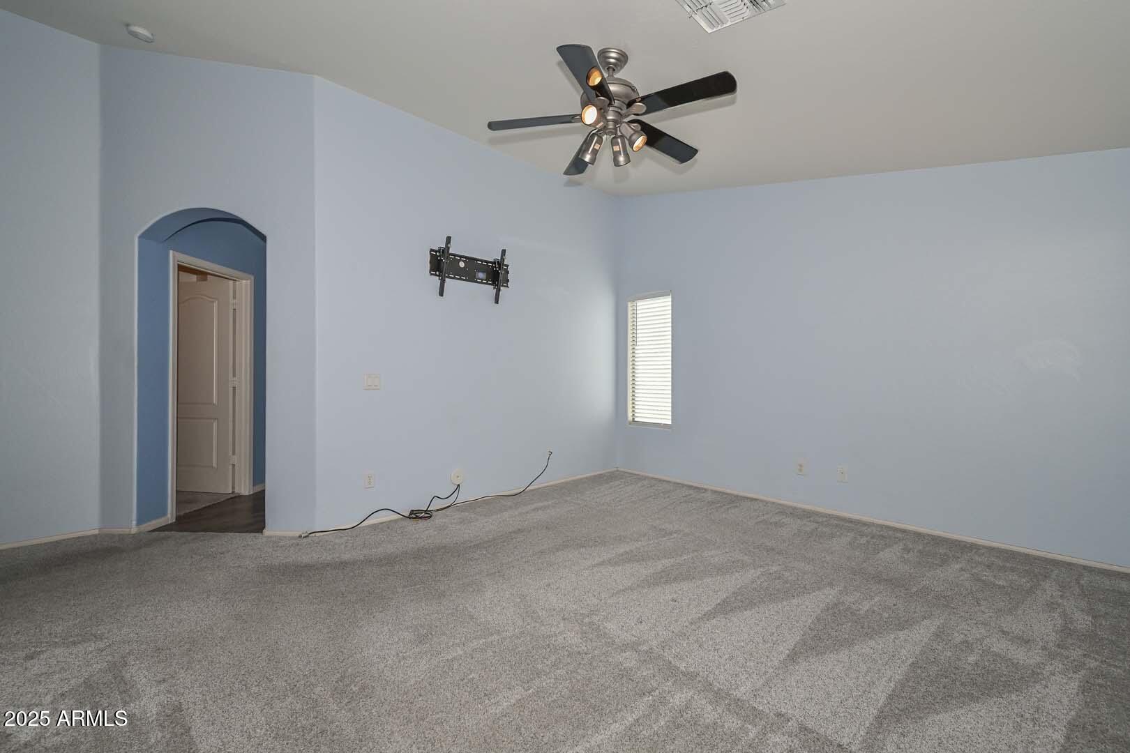 17687 West Charter Oak Road Surprise, AZ 85388 - Photo 26 of 52 a view of room with a ceiling fan and window
