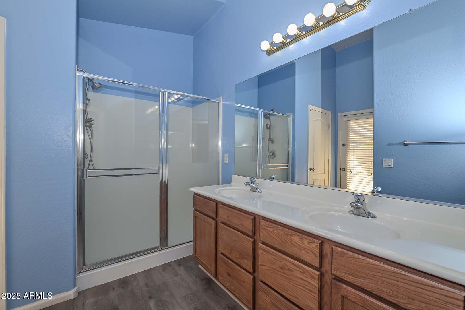 17687 West Charter Oak Road Surprise, AZ 85388 - Photo 28 of 52 a bathroom with a sink double vanity and a mirror
