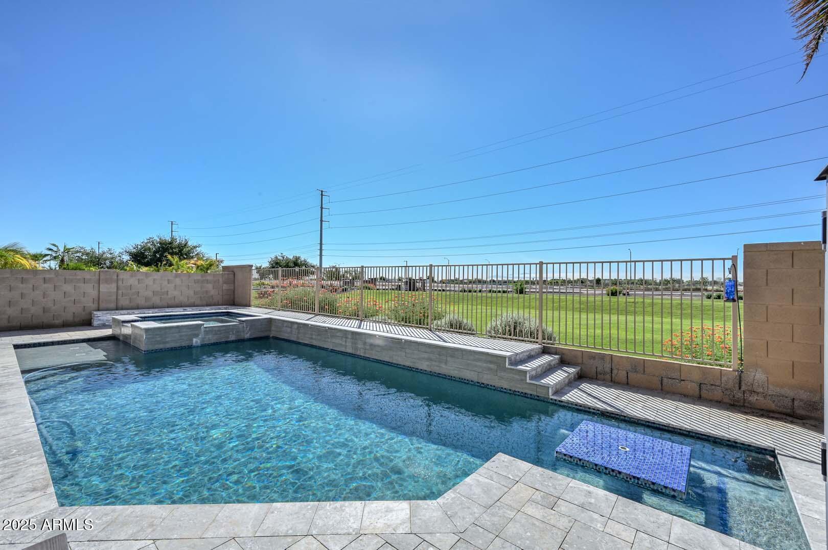 17687 West Charter Oak Road Surprise, AZ 85388 - Photo 41 of 52 a backyard of a house with lots of green space