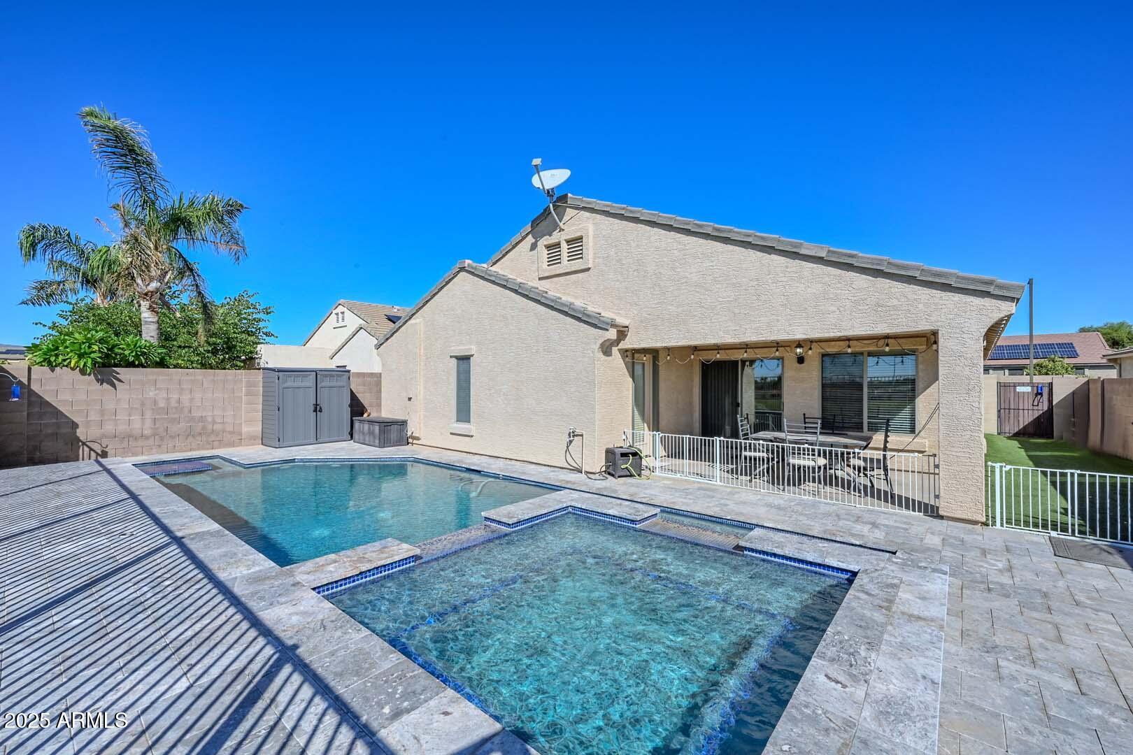 17687 West Charter Oak Road Surprise, AZ 85388 - Photo 42 of 52 a view of a house with backyard and sitting area