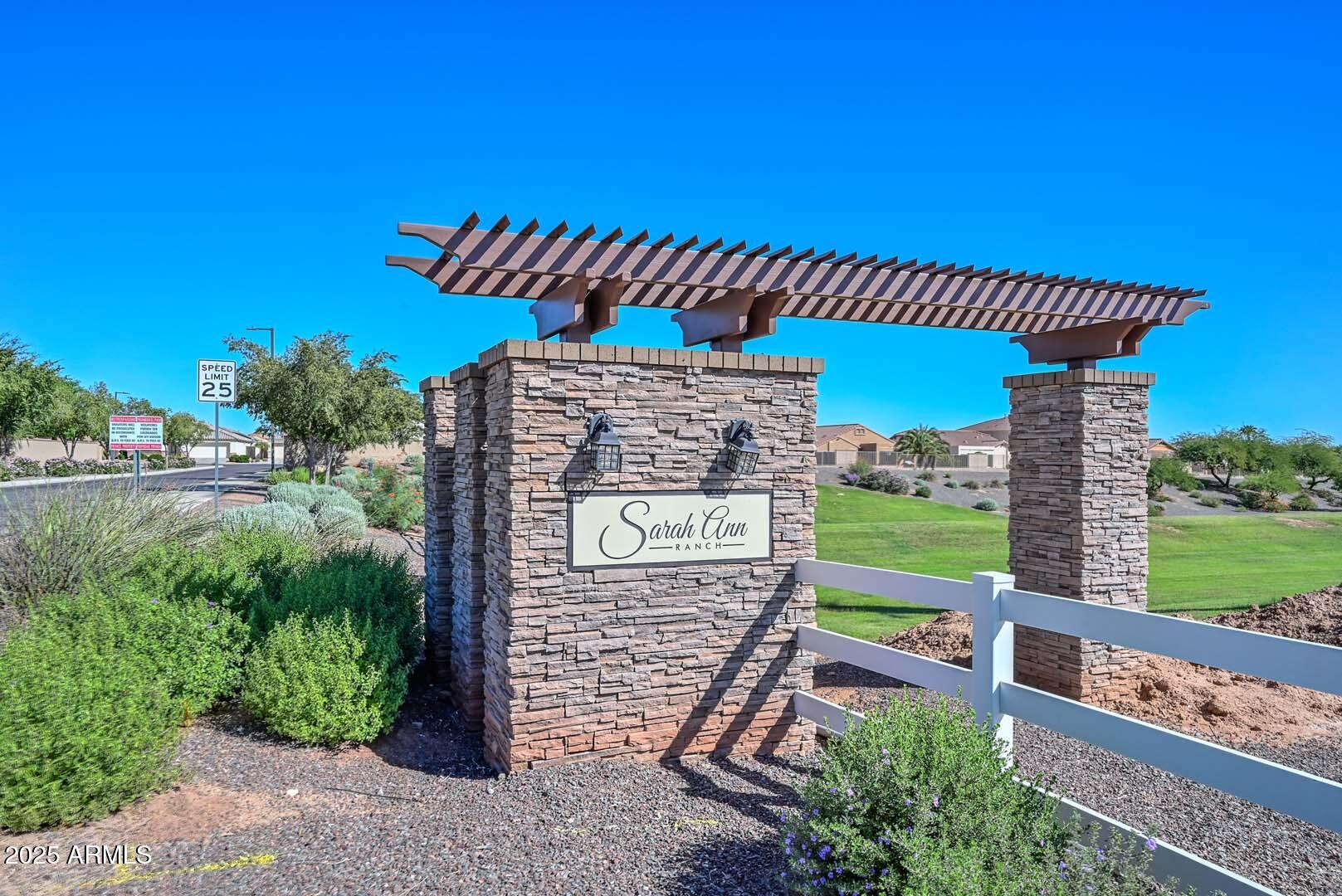 17687 West Charter Oak Road Surprise, AZ 85388 - Photo 43 of 52 a front view of a house with garden