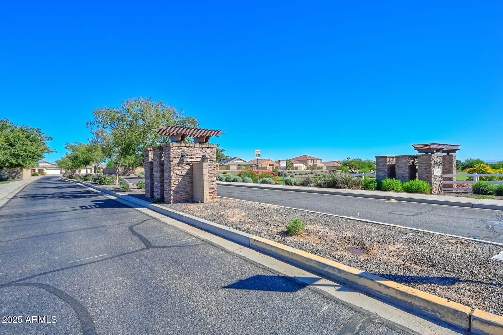 17687 West Charter Oak Road Surprise, AZ 85388 - Photo 44 of 52 a view of a street with a building in the background