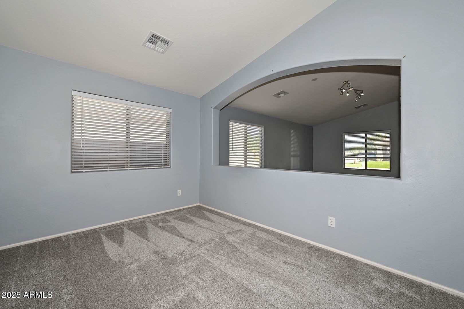 17687 West Charter Oak Road Surprise, AZ 85388 - Photo 8 of 52 a view of an empty room with a window