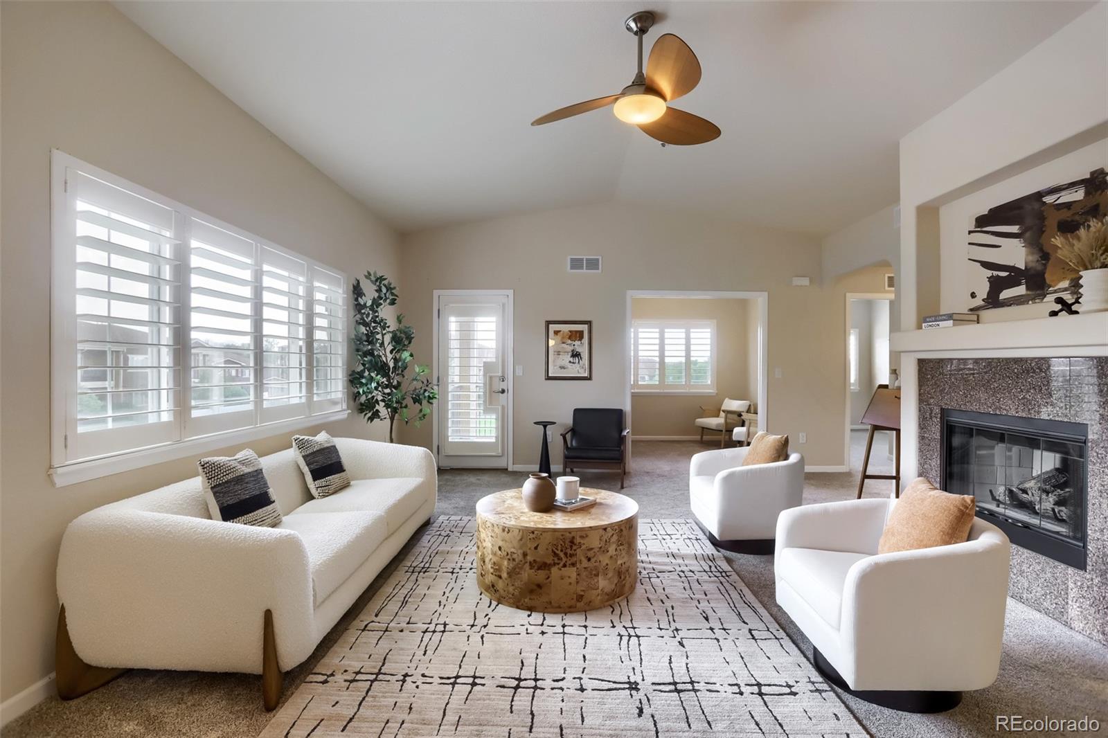 6232 Kilmer Loop, Unit 203 Golden, CO 80403 - Photo 8 of 33 a living room with furniture and a fireplace