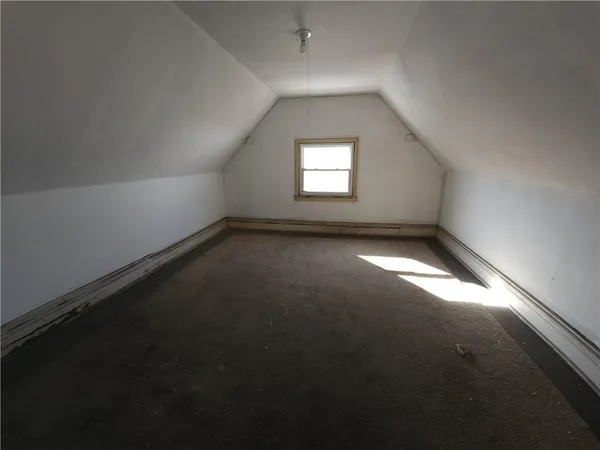 an empty room with a empty space and window