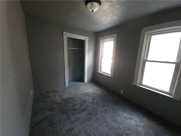 a view of an empty room and window