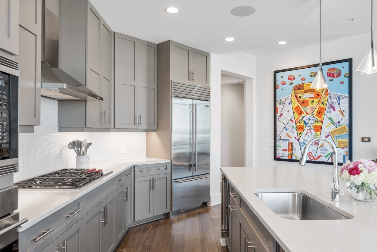 20 Rutledge Street, Unit 407 Nashville, TN 37210 - Photo 15 of 56 a kitchen with stainless steel appliances granite countertop a sink stove and refrigerator