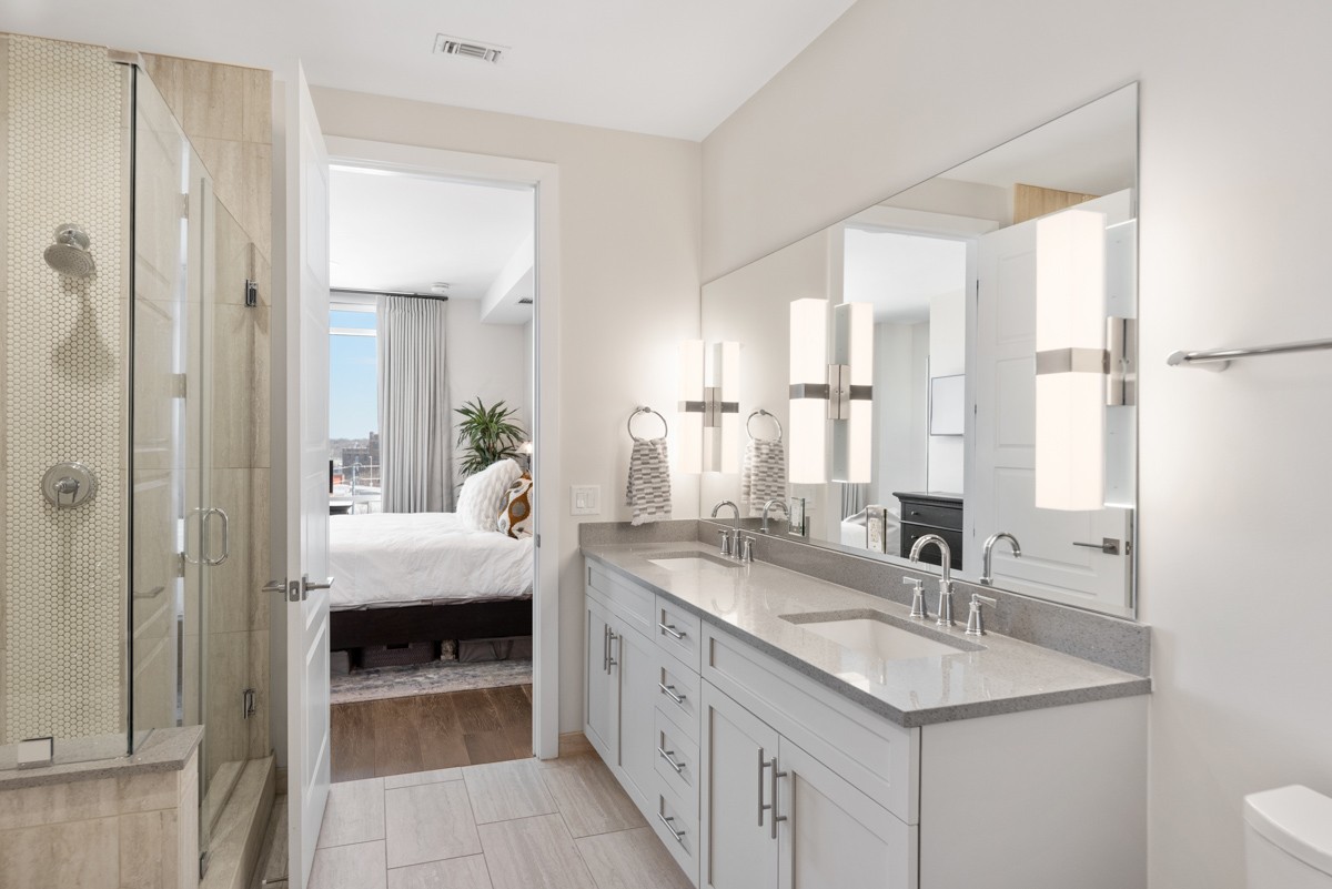 20 Rutledge Street, Unit 407 Nashville, TN 37210 - Photo 25 of 56 a en suite bathroom with a sink and mirror