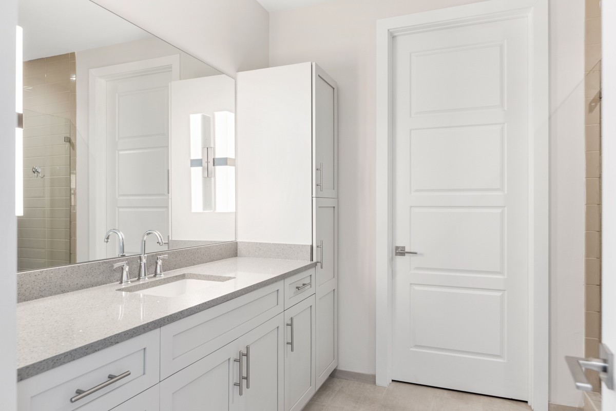 20 Rutledge Street, Unit 407 Nashville, TN 37210 - Photo 33 of 56 a bathroom with a double vanity sink and a mirror